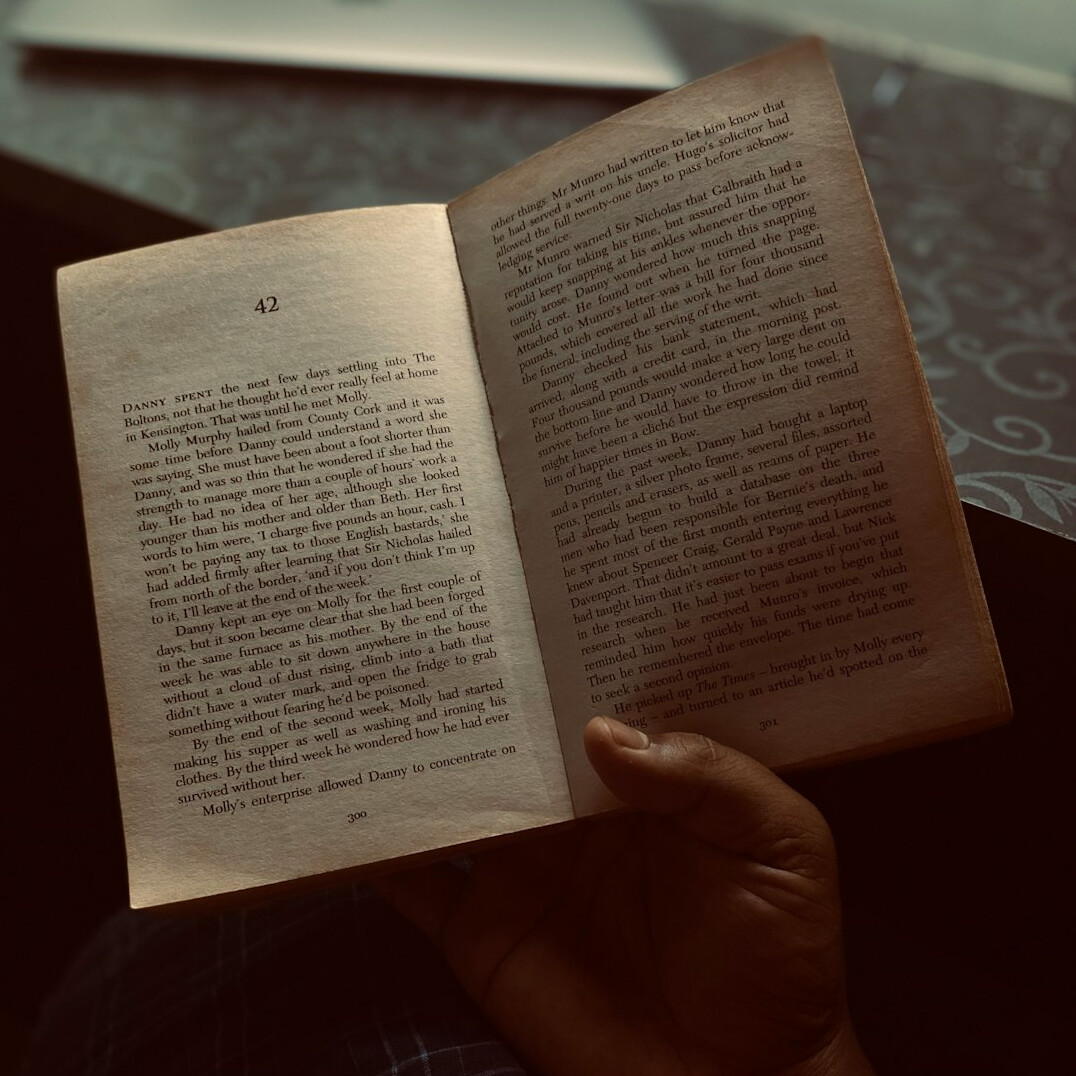 person turning book page
